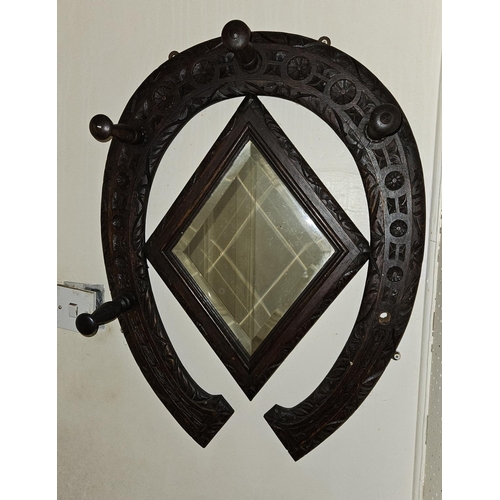 108 - A 19th Century Oak wall mounted hat Rack in a horseshoe shape.