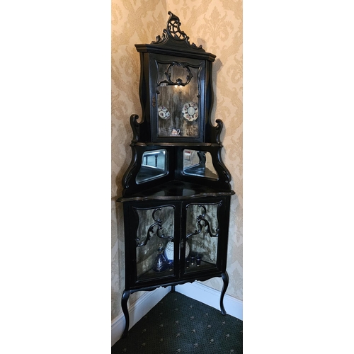 60 - A good late 19th Century Ebonised corner Cabinet with glazed doors.
H 210 x 77 x 57 cm approx.