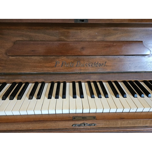 63 - A P Putz Dusseldorf upright Piano in a Walnut frame.
H 162 x W 142 x D 64 cm approx.