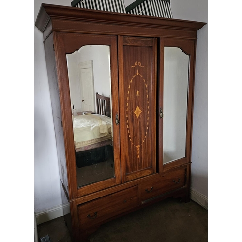 88 - An Edwardian Mahogany and inlaid single door Wardrobe.