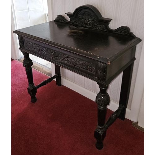 97 - A 19th Century Oak single drawer Side Table probably Irish with a highly carved outline and gallery ... 