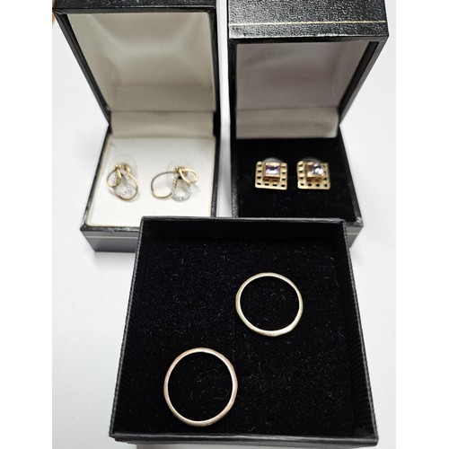 300 - Two pairs of 9ct Gold Earrings along with two 9ct Gold Rings. Total weight 6grms.