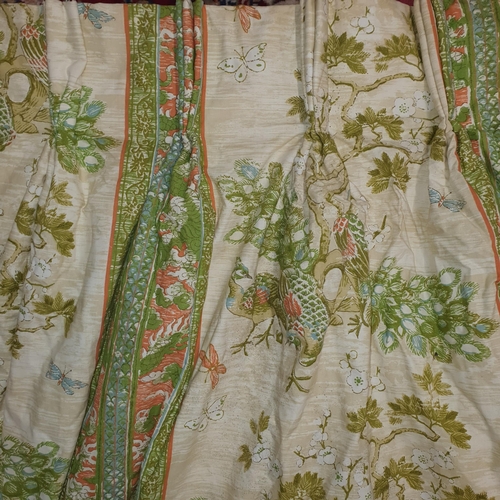 424 - A Large pair of Double Lined Curtains, Green ground depicting Peacocks. 
Peated Top width 85 cm each... 