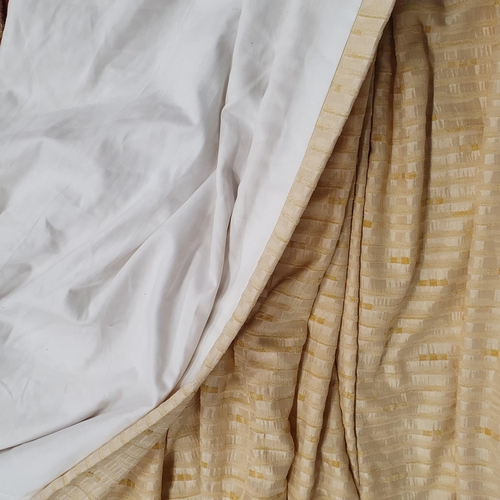 427 - A Large pair of Lined Curtains, Cream ground. 
Good condition, very clean.
Peated Top width 105 cm e... 