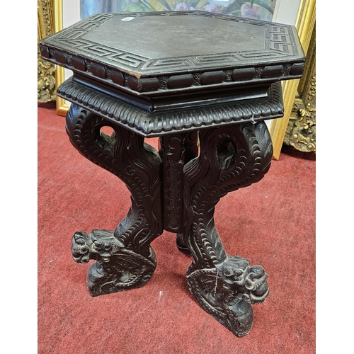 146 - An Ebonised Urn Stand.