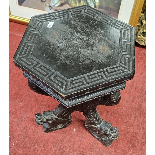 146 - An Ebonised Urn Stand.