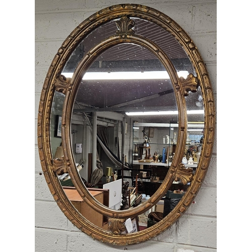 166 - A gold pierced oval Mirror.