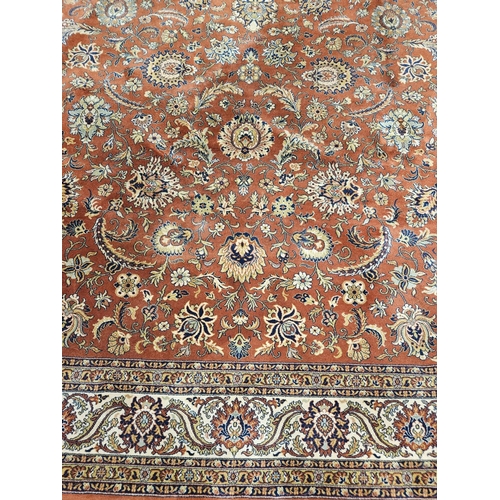 413 - A fabulous large Rust ground Wool Carpet with all over unique medallion design and multi borders.
L ... 