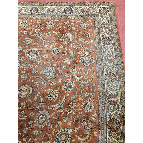 413 - A fabulous large Rust ground Wool Carpet with all over unique medallion design and multi borders.
L ... 