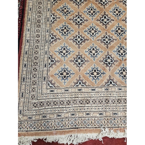 419 - A Pink/Salmon ground Rug with repeating design.
L 235 x W 156 cm approx.