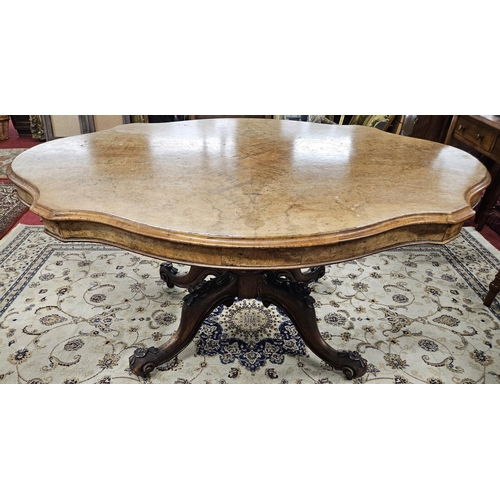 465 - An impressive 19th Century Walnut and Burr Walnut Centre Table of large size with a carved scissors ... 