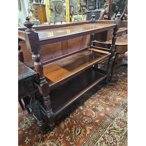 352 - A 19th century Mahogany three tier Dumbwaiter of neat size on turned supports.
H 110 x L 120 x D 44 ... 