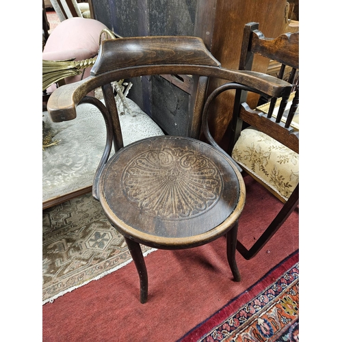 64 - A 19th Century Bentwood Armchair along with a 19th Century rise and fall piano Stool.