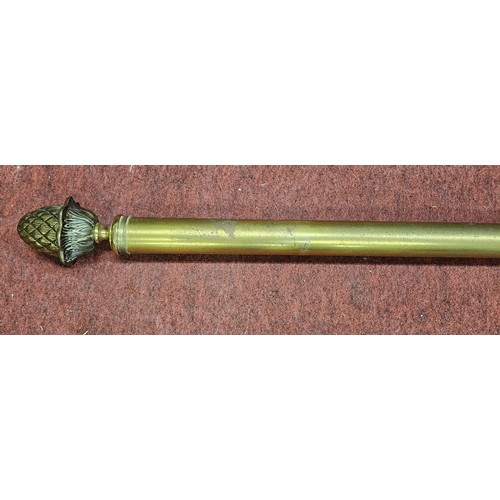 375 - A good Brass curtain Pole with rings, 270cm approx.