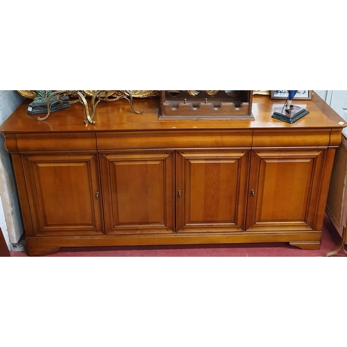 385 - A large Cherrywood three door low Cabinet. 181 x 49 x H 84 cm approx.