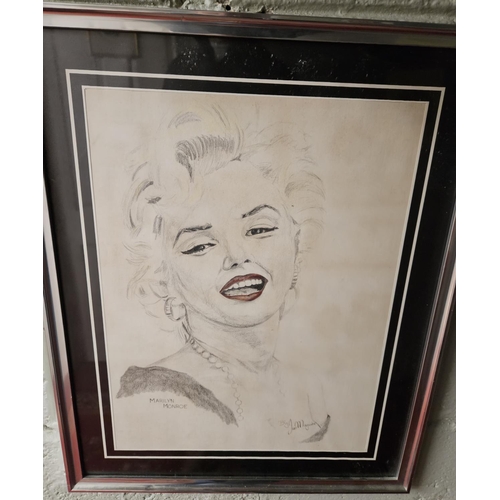 549 - Jan Maguire. A Pencil and Ink highlighted in Watercolour of Marilyn Monroe. 41 x 31 cm approx.