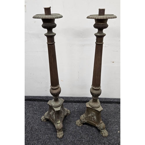 637 - A good pair of 19th Century Brass Candlesticks. H 64 cm approx.