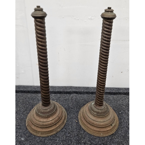 724 - A pair of 19th Century Brass Candlesticks. H 50 cm approx. missing tops.