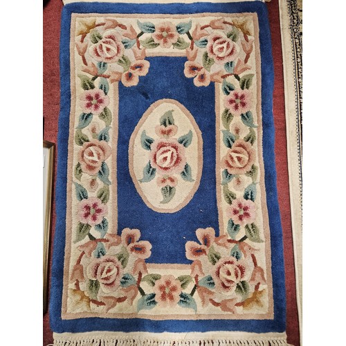 745 - A Blue ground Oriental Rug.
L 95 x W 60 cm approx.