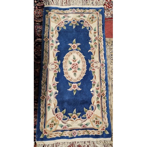 746 - A Blue ground Oriental Rug, 155 x 75 cm approx.