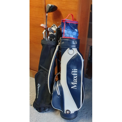 769 - Two Golf Caddy bags with twelve Golf Clubs, a quantity of Golf Balls and a set of hand dumbbell weig... 