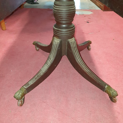 792 - A 19th Century Pembroke Table with solid Mahogany top and brass claw castors (lacking end drawer).
H... 