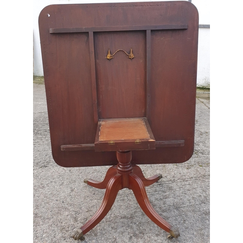 796 - A late 19th Century Mahogany Tilt top Breakfast Table on Brass caster Claw feet.