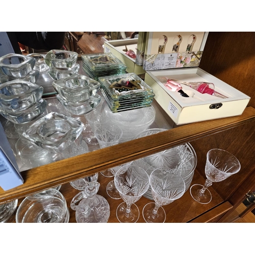 891 - A good quantity of Irish and other Crystal along with other decorative items. On two shelves.