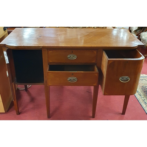 914 - A late 19th Century Mahogany and crossbanded Sideboard with twin drawers flanked by single doors on ... 