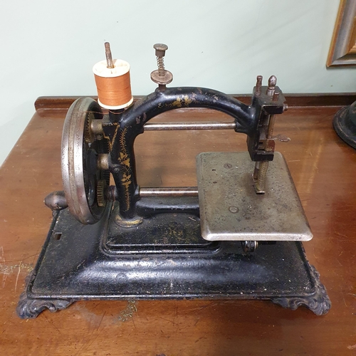 33 - A Vintage Fan along with a Vintage Mini Sewing Machine.