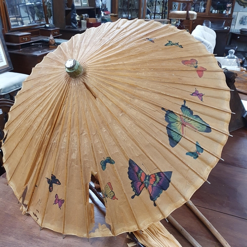 135 - A quantity of vintage Walking Sticks and Parasols.