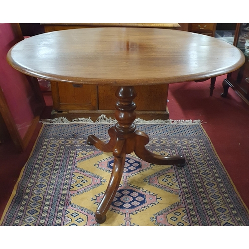 202 - A 19th Century Mahogany Oval Supper Table on tripod supports. H 77 x 105 x 84 cm approx.