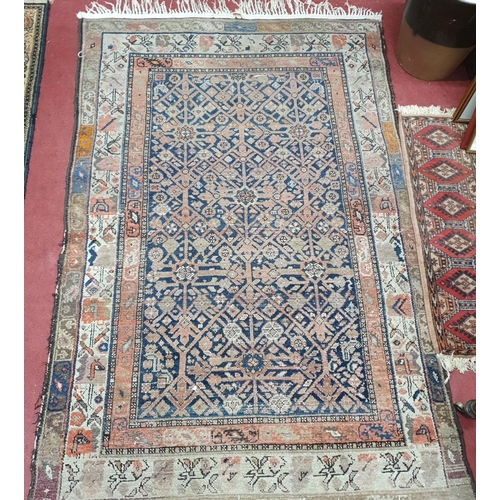 225 - A Persian red and cream ground Rug. 124 x 190 cm approx.