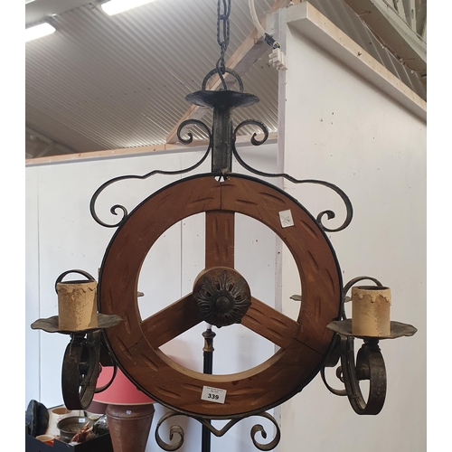 274 - A 20th Century Metal and Timber medieval style Light. W 50 x Drop 80 cm approx.