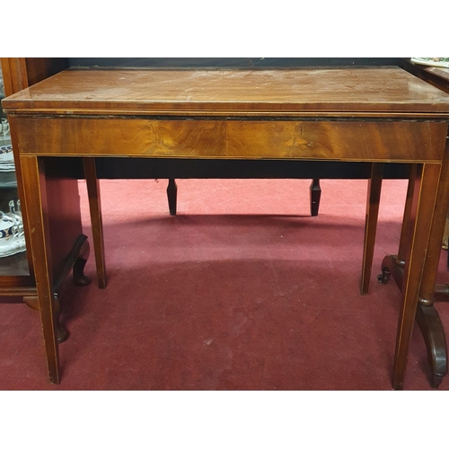 277 - A Regency Mahogany Foldover Card Table with inlaid corners and square tapered supports. H 73 x W 90 ... 