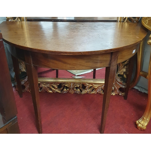 299 - A Georgian Mahogany half moon Table with square tapered supports. H 73 x 106 x 52 cm approx.