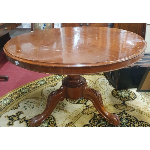 333 - A Victorian Mahogany circular Supper Table raised on a turned pillar and tripod base with acanthus d... 