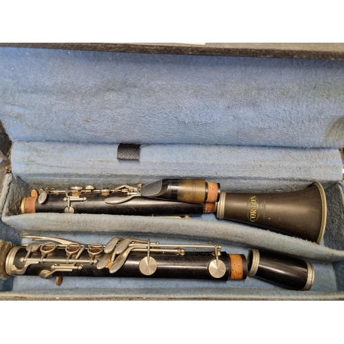 389 - A Clarinet with carry case (non matching parts).L 65 cm approx.