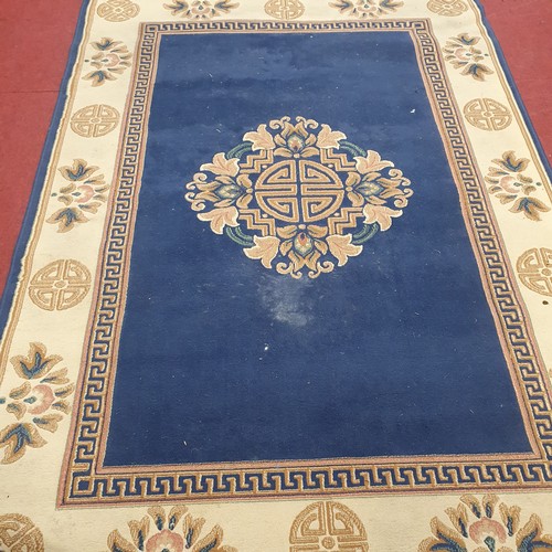 403 - A Blue and Tan Carpet.
L 288 x W 160 cm approx.