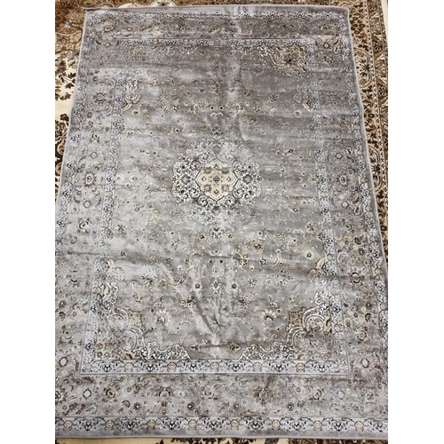 407 - A Gray/ Silver Kasmir style ground Carpet.
L 227 x W 154 cm approx.