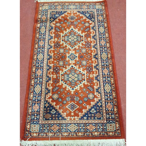 414 - Dark Terracotta and Blue Rug .
L 160 x W 80 cm approx.