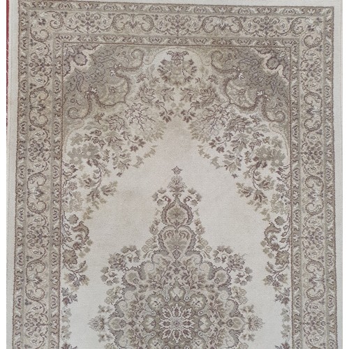 416 - Eastern style cream ground wool pile rug with central floral medallion, multiple floral borders 178c... 