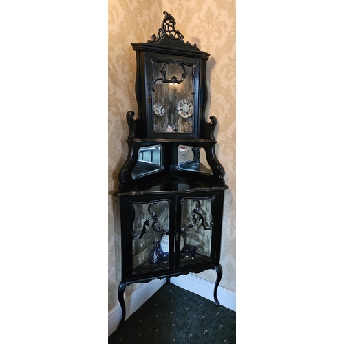 433 - A good late 19th Century Ebonised corner Cabinet with glazed doors.
H 210 x 77 x 57 cm approx.