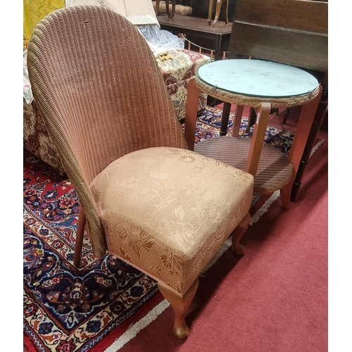 465 - A Lloyd Loom Wicker Side Table with glass top along with a Lloyd Loom chair.
table H 60 x D 48 cm ap... 