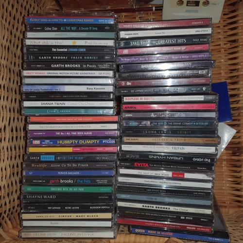 489 - A large quantity of CD'S in a wicker basket