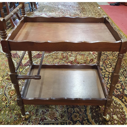 605 - A neat 2 Tier Trolley along with a lace table cloth.