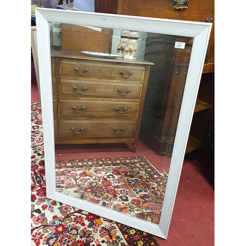 653 - A Rectangular Bevelled Mirror.
100 x 70 cm approx.