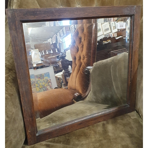 658 - A Rectangular Bevelled Mirror in timber frame.
42 x 44 cm approx.