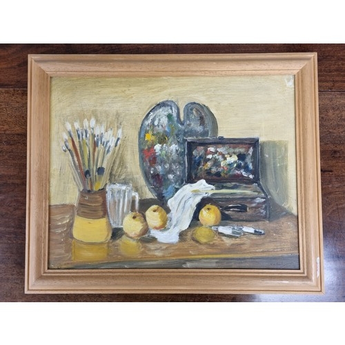 669 - A 20th Century Oil on Board still life of an artists table. Indistinctly signed LR. 38 x 48 cm appro... 