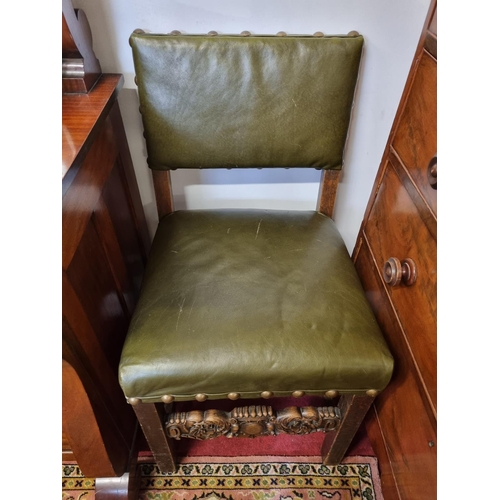 680 - An early 20th Century Oak Chair with a fully upholstered Green leather and studded seat and back. H ... 